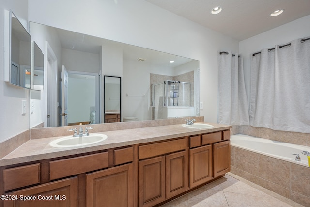 bathroom with vanity, tile patterned floors, and separate shower and tub