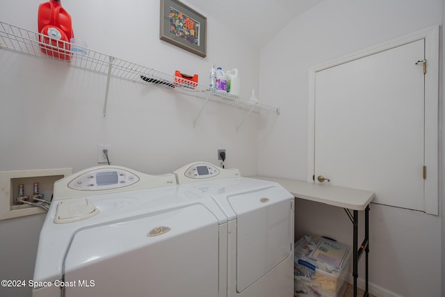 clothes washing area featuring independent washer and dryer