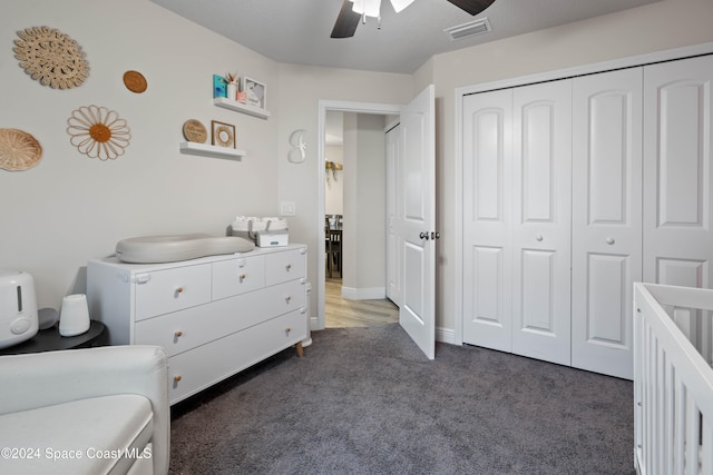 carpeted bedroom with a closet and ceiling fan