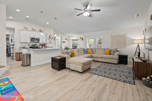 living room featuring light wood-type flooring, ceiling fan, and lofted ceiling