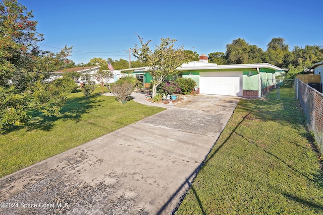 view of front of house featuring a garage and a front yard