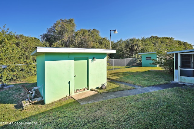 view of outdoor structure with a yard