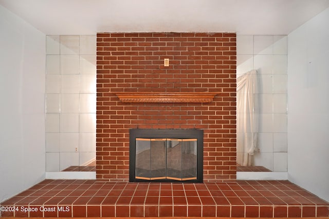 room details featuring a brick fireplace