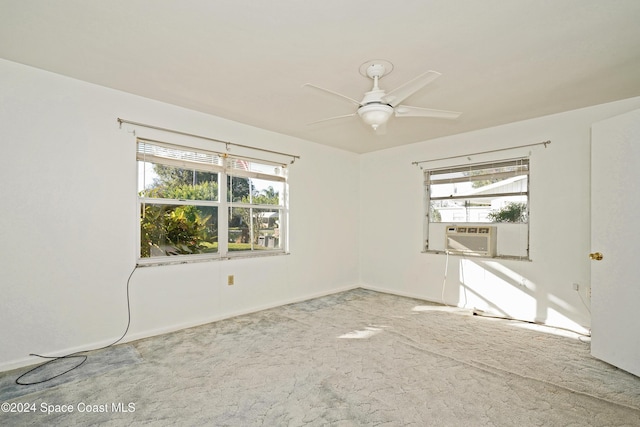 empty room featuring carpet, plenty of natural light, and ceiling fan