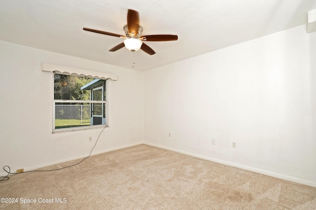 empty room with carpet floors and ceiling fan