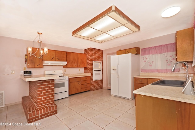 kitchen featuring kitchen peninsula, white appliances, sink, pendant lighting, and light tile patterned floors