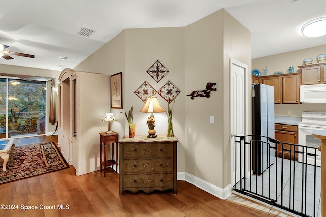 corridor featuring hardwood / wood-style floors