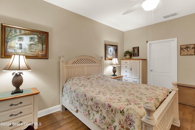 bedroom with dark wood-type flooring and ceiling fan