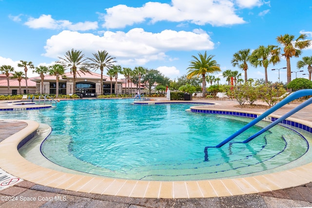 view of swimming pool with a patio area