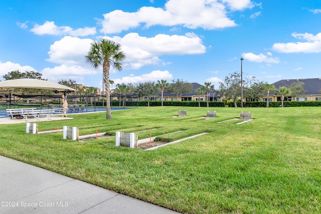 view of property's community featuring a yard and a gazebo