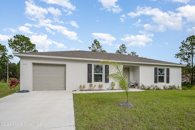 ranch-style house with a garage and a front lawn