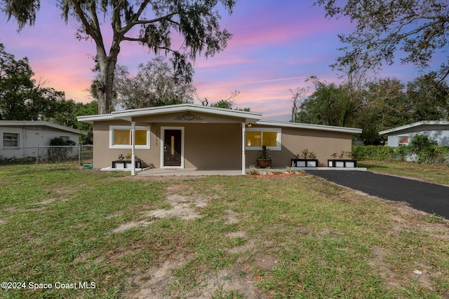 view of front of property with a lawn