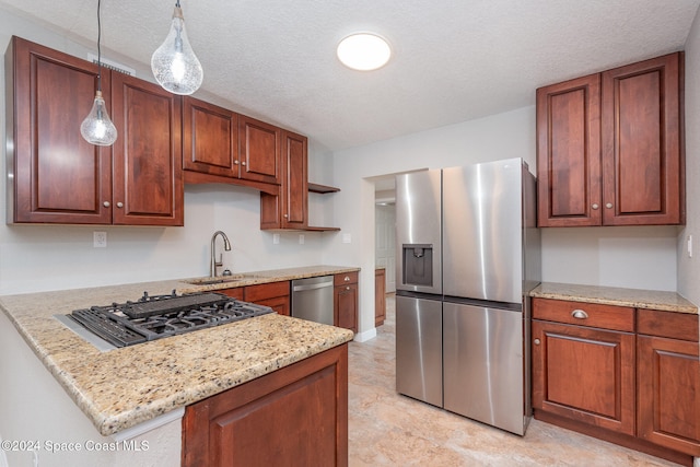 kitchen featuring hanging light fixtures, stainless steel appliances, light stone counters, kitchen peninsula, and a textured ceiling