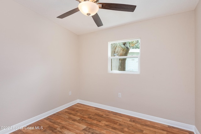 unfurnished room with hardwood / wood-style floors and ceiling fan