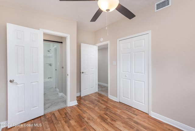 unfurnished bedroom featuring a closet, ceiling fan, and light hardwood / wood-style flooring