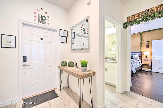 entryway with light hardwood / wood-style floors