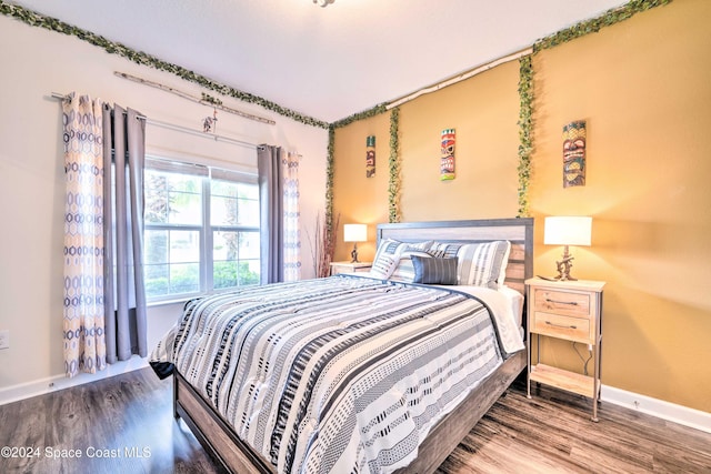 8988 Stinger Dr, Davenport, FL 33896 - bedroom with wood finished floors and baseboards