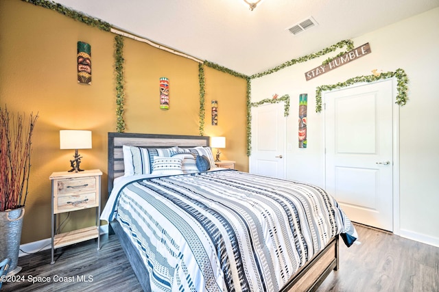 bedroom featuring hardwood / wood-style flooring