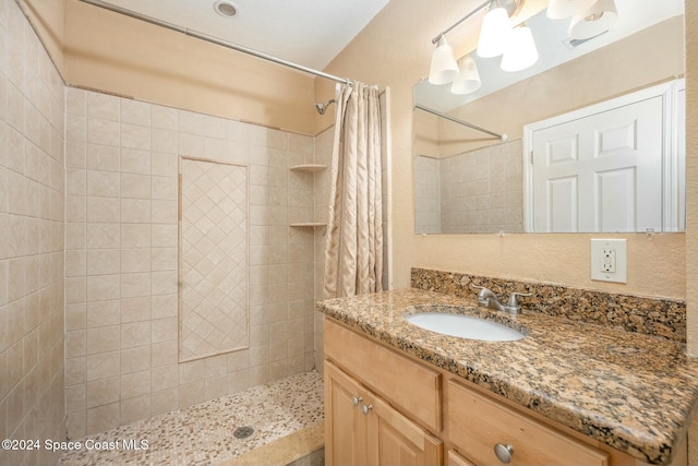 bathroom with vanity and curtained shower