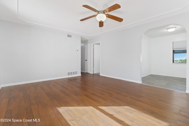 unfurnished room with hardwood / wood-style flooring and ceiling fan