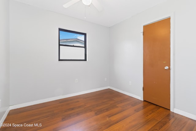 empty room featuring ceiling fan and wood-type flooring