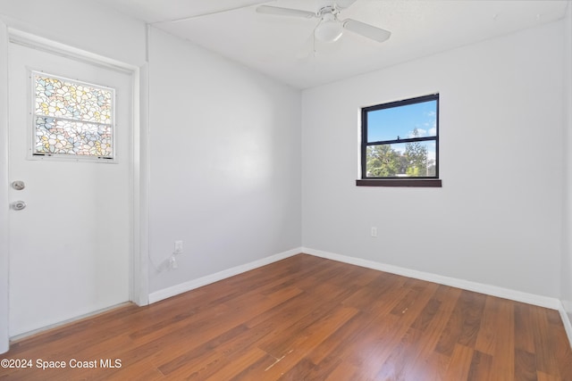 unfurnished room featuring hardwood / wood-style floors, ceiling fan, and plenty of natural light