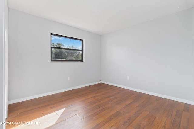 spare room featuring hardwood / wood-style floors