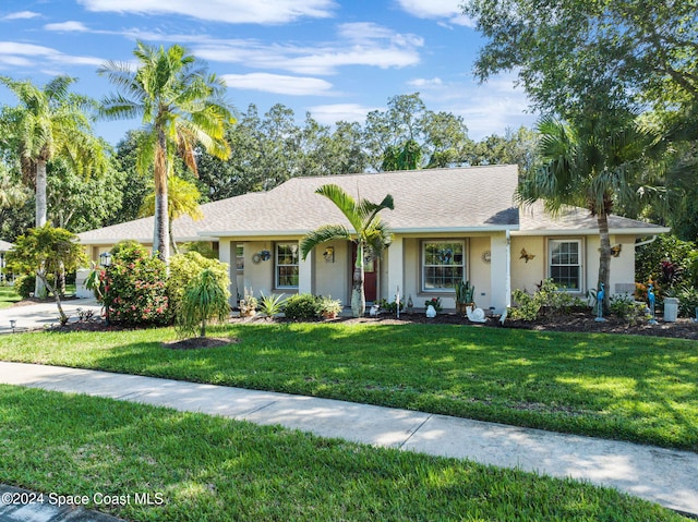 ranch-style home with a front yard