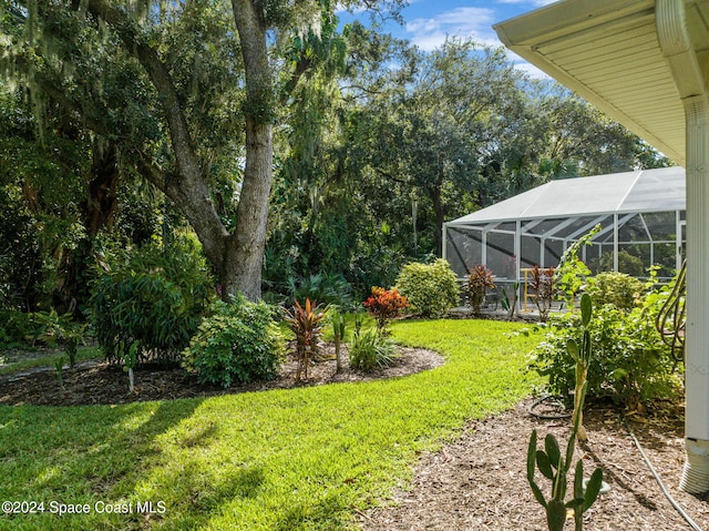 view of yard with a lanai