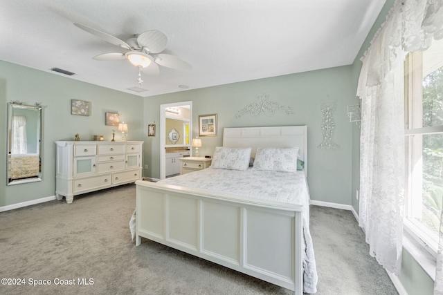 carpeted bedroom with ceiling fan