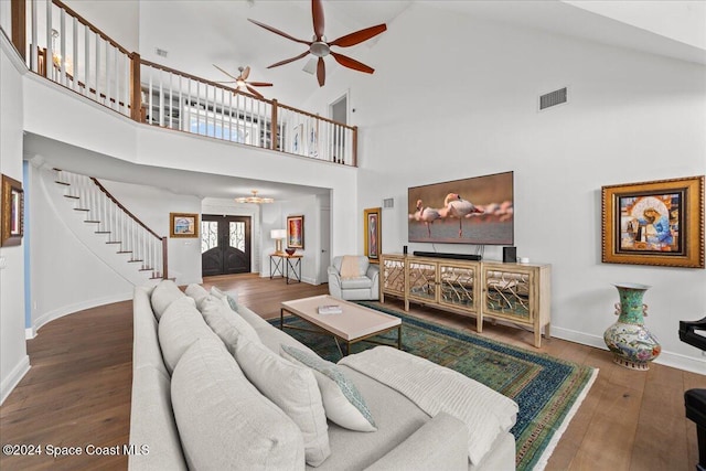 living room featuring french doors, hardwood / wood-style flooring, high vaulted ceiling, and ceiling fan