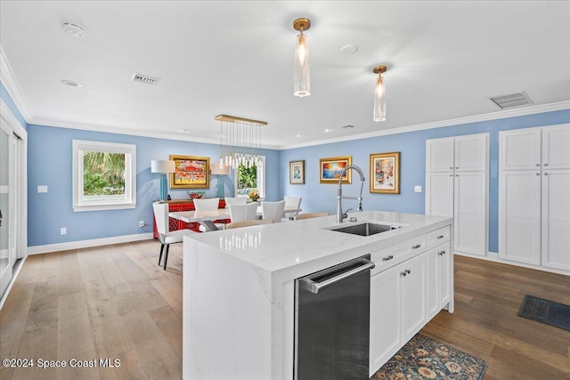 kitchen with dishwasher, sink, crown molding, wood-type flooring, and white cabinets