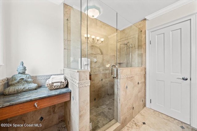 bathroom with a chandelier, a shower with shower door, and ornamental molding