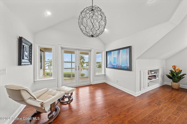 sitting room featuring lofted ceiling, french doors, and dark hardwood / wood-style floors