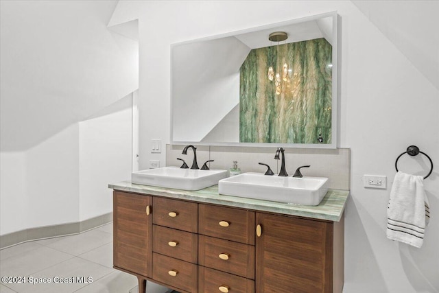 bathroom featuring tile patterned floors, decorative backsplash, and vanity