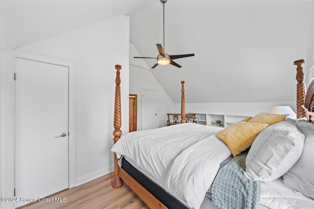 bedroom with vaulted ceiling, ceiling fan, and light hardwood / wood-style floors