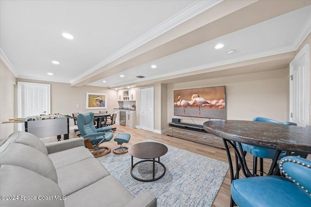 living room with light hardwood / wood-style flooring and ornamental molding