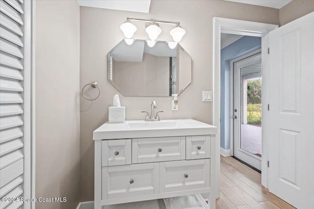 bathroom with vanity and wood-type flooring