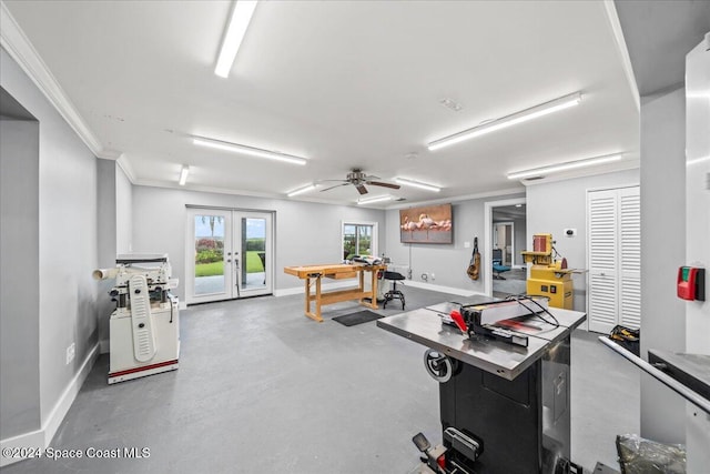 game room with concrete flooring, french doors, ceiling fan, and ornamental molding