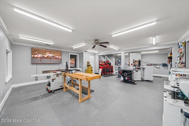 interior space with a workshop area, concrete floors, ceiling fan, and crown molding