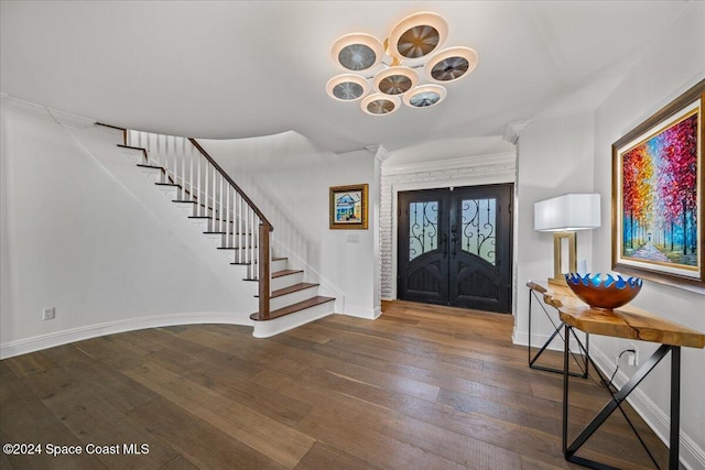 entryway with french doors and dark wood-type flooring