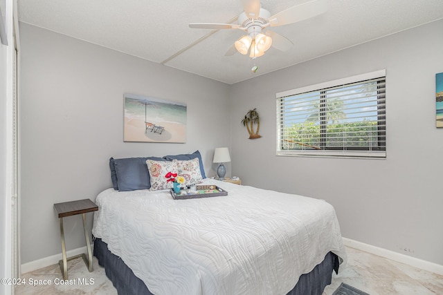 bedroom featuring ceiling fan