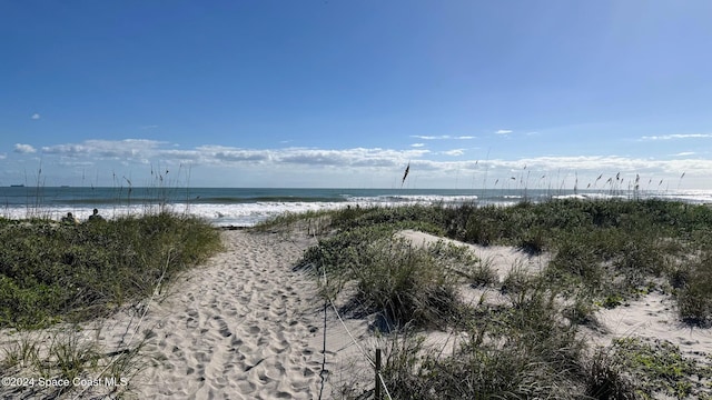 property view of water featuring a beach view