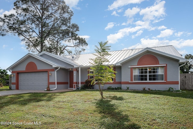 single story home with a garage and a front lawn