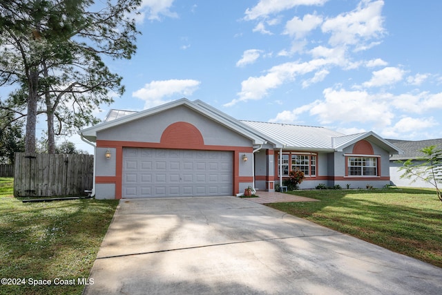 ranch-style home with a garage and a front yard