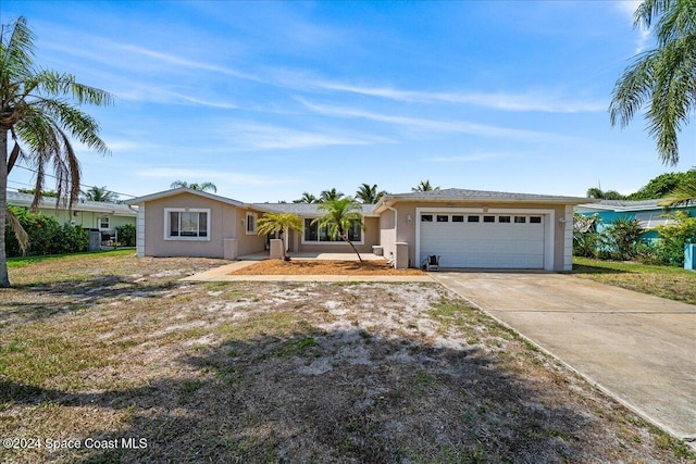 single story home with a front lawn and a garage