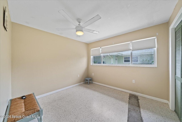 spare room featuring ceiling fan