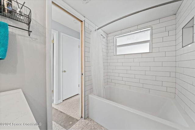 bathroom with shower / bath combination with curtain