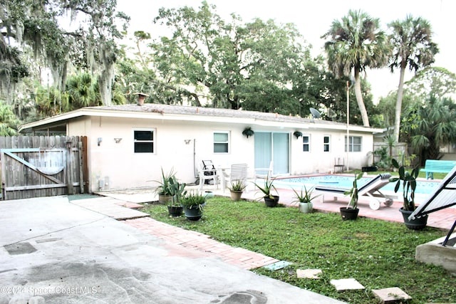 rear view of property featuring a patio