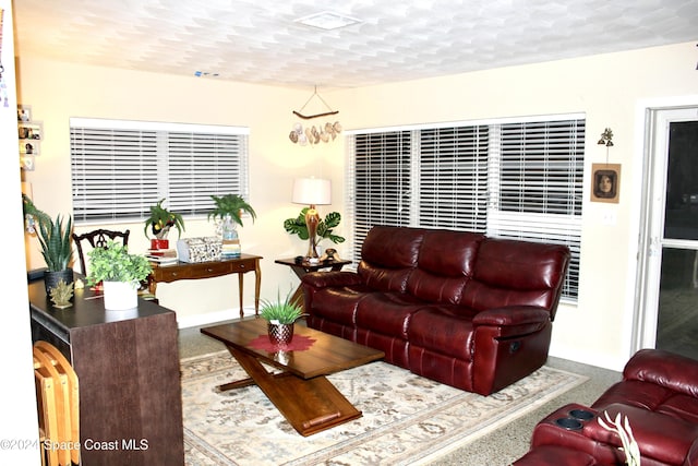 139 W Laila Dr W, Melbourne, FL 32904 - living room featuring baseboards